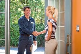 A GitHelp worker greeting a homeowner at the front door